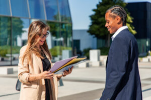 Sales professionals prospecting possible customers using documents.